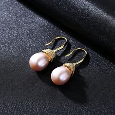 Enhance your natural glow with the right kind of luster, through the splendor of real pearl earrings. Less is definitely more when it comes to these dainty, yet utterly radiant white pearl drop earrings that capture the light from every angle. Measuring 10mm, the Freshwater pearl earrings are the ideal jewelry piece to compliment your wardrobe. our earrings come in fine settings: 14K yellow gold. * Buy over 2 pieces and get a medium jewelry organizer * Buy over $100 and get a large mirror jewelr Elegant High Luster Pearl Earrings Gift, Rose Gold Akoya Pearl Earrings For Gift, Elegant High Luster Pearl Earrings, Elegant Round Pearl Earrings With High Luster, Elegant Rose Gold Pearl Earrings As Gift, Elegant Rose Gold Pearl Earrings For Gift, Hypoallergenic Rose Gold Round Pearl Earrings, Exquisite Pearl Earrings For Gifts, Elegant Rose Gold Akoya Pearl Earrings