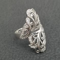 Vintage 925 Solid Sterling Silver Butterfly Wing Floral CZ Cubic Zirconia Statement Ring Size 11 Thoroughly inspected, 100% Authentic 925 Sterling Silver ring.  Size 11 0.2ozt Weight  Buy with confidence! With over 30 years in the jewelry industry, our expert staff has inspected and tested this product for authenticity and purity. Our jewelry weights are taken on a scale certified  by the Department Of Weight & Measures and are guaranteed to be accurate.  All of our beautiful handcrafted vintage Dazzling Silver Rings With Diamond Accents, Silver Rings With Pave Setting As A Gift, Silver Rings With Pave Setting For Gift, Elegant Silver Diamond Ring With Sparkle, Silver Diamond Ring With Open Design, Silver Diamond Ring With Open Design And Accents, Dazzling Silver Hallmarked Rings, Silver Diamond Ring With Pave Setting As Gift, Silver Filigree Ring With Diamond Accents In Cubic Zirconia