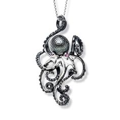 an octopus necklace with pearls on it