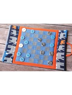 a blue and gray board with buttons on it