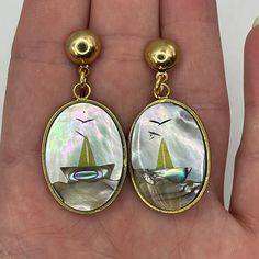 Vintage handmade gold plated mother of pearl charms on deadstock gold earring post. about 2in in length. Nickel-free Gold Mother Of Pearl Jewelry, Gold Dangle Earrings With Mother Of Pearl, Scene Earrings, Earring Post, Gold Earring, Pearl Charms, Handmade Gold, Vintage Handbags, Post Earrings