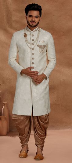 Jacquard Dhoti Sherwani in White and Off White with Patch work Art Silk Sherwani For Wedding With Chikankari Embroidery, Chikankari Embroidery Art Silk Sherwani For Wedding, Wedding Art Silk Sherwani With Chikankari Embroidery, White Fitted Jamawar Bandhgala, White Bandhgala With Resham Embroidery, White Brocade Sherwani With Traditional Drape, White Brocade Kurta With Traditional Drape, White Jamawar Sherwani With Intricate Embroidery, White Brocade Kurta For Diwali