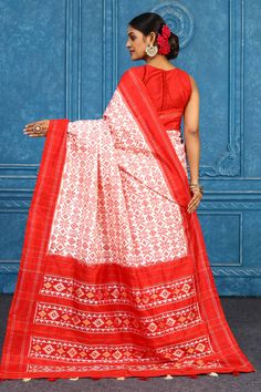 Alluring cream Pochampally ikkat silk saree with red border is a perfect drape for parties and festive occasions. It comes with a matching blouse piece. Disclaimer: The shown stitched blouse on the model is for display purpose only. The saree comes with a matching blouse piece and finished with fall and piko. Bollywood Style Red Ikat Print Dupatta, Red Ikat Print Bollywood Dupatta, Red Bollywood Dupatta With Ikat Print, Red Ikat Print Dupatta, Festive Red Ikat Print Dupatta, Red Art Silk Blouse With Printed Border, Diwali Red Blouse Piece With Printed Border, Red Ikat Print Saree With Traditional Drape, Red Handloom Tussar Silk Set