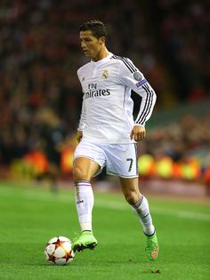 the soccer player is about to kick the ball in his team's match with real madrid