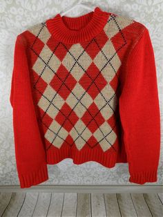 "Boy's Argyle Sweater 3T/4T, Red and Tan, Preppy Diamond Pattern, Acrylic Weave, 1980's Winter Clothing, Child's Pullover Sweater Sweater is 14\" long total length, crew collar is 5 1/2\" wide. Cuffs are 3\" wide. Sleeves are 15 3/4\" long. 13\" across bottom of sweater. Red pull over sweater, 3T 4T, no tag, going by sweaters sold online. Know your child's measurements. Sharp, preppy Argyle pattern in tan with dark blue accents. Great ready to wear sweater for a little boy, needing a sharp look. Red Retro Winter Tops, Retro Red Tops For Winter, Vintage Red Top For Winter, Vintage Red Tops For Winter, Red Vintage Tops For Fall, Retro Fall Sweater, Vintage Red Fall Sweater, Vintage Red Sweater For Winter, Red Vintage Sweater For Winter