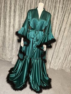 This vintage Emerald Green Hollywood inspired long robe is handmade from a super soft slight stretch satin with a marabou feather trim and matching belt. The perfect robe to strut around the house in, for a photoshoot, for as a stunning bridal wedding robe. Also available in a long version and other colours available. Can be customised in any way, please just message me with your ideas! All items can be custom made to fit your measurements. Please allow 7-14 working days for your item to be made and posted to you, however if you require your items for a certain date please just send me a message and I'll see what I can do! Royal Robes, Fancy Robes, Gowns Aesthetic, Hollywood Vintage, Green Feather, Handmade Lingerie, Hollywood Style, Wedding Robe, Feather Trim