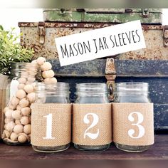 mason jars with numbers are sitting on a table