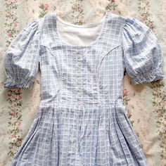 "❀ Light blue check Austrian dress ✿ * Short puffed sleeves * Button up front * Textured cotton fabric * Falls around mid-calf Estimated modern size - XSmall / Small, UK 6 - but please refer to the measurements below Fabric - Cotton Age - 1960s / 70s Fit - Fitted waist and bodice Condition - Light wear 43\" Length, from shoulder 26\" Full waist 34\" Full bust Women's sizing guide: XS - UK 4 - 6 Small - UK 8 - 10 Medium - UK 12 - 14 Large - UK 16 + If you would like another measurement or are uns Coral Jeans, Ditsy Floral Dress, Cute Aprons, Blue Check, Blue Skirt, Puffed Sleeves, Dress Short, Favorite Dress, Dress Clothes For Women