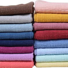 a stack of folded towels sitting on top of each other