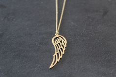 A lovely gold plated angel wing pendant hangs from a fine gold plated chain necklace. Angel wing pendant is matt gold plated over brass, size - 43.5 x 14.5mm Fine link chain necklace is gold plated, various sizes available, please select the length you require above. ★ All items arrive in a gift box with ribbon.  Ready to ship.  Personalized messages and direct shipping to the recipient available on request. ★ If you would like more than 1, please convo me.  I offer discounts for multiple purchases. Please read my shop policies for details on shipping, delivery etc. https://www.etsy.com/Littlemissjdesigns/policies ♥ ♥ ♥ Visit my boutique for more designs: ♥ ♥ ♥ http://www.littlemissjdesigns.etsy.com Thanks for looking! Little Miss J x © Little Miss J Designs 2020 All rights reserved Gold Winged Necklace For Gift, Gold Winged Necklace Perfect As A Gift, Elegant Gold Angel Wings Necklace, Elegant Gold Necklace With Angel Wings, Gift Box With Ribbon, Gold Angel Wings, Box With Ribbon, Angel Wing Necklace, Angel Wing Pendant