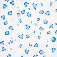 an animal print fabric with blue and white spots