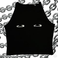 Introducing the **Safety Pin Vest Top where alternative fashion meets punk rock rebellion. This edgy and versatile top is designed to make a bold statement, regardless of gender. **Material and Comfort Made from a premium blend of 93% cotton and 7% elastane, this vest top offers a soft, breathable fit with just the right amount of stretch to ensure comfort and durability. The high-quality fabric ensures that the top moves with you, maintaining its shape and style throughout the day. **Design and Casual Crop Top For Alternative Fashion, Edgy Cotton Club Tops, Black Punk Style Tops For Club, Fitted Punk Crop Top For Streetwear, Black Y2k Top For Alternative Fashion, Punk Sleeveless Top For Club, Punk Crop Top For Streetwear, Punk Crop Top For Night Out, Alternative Style Tank Top For Night Out