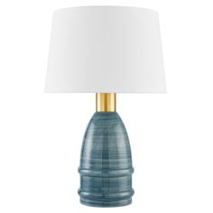 a blue table lamp with a white shade