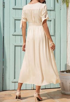 The EMES SHOP dress is detailed with fun tie sleeves. Features a v neck line. button down design. short sleeves. flowy dress. and mid-calf length. Pair it with sunnies and espadrilles for a magnificent summer look.MATERIALS: 91-99 % PolyesterMEASUREMENTS: Product length is 50"-51.9" 4-6-Small | Waist: 25-26.5 in | Chest: 33-34.5 in | Hips: 35-36.5 in 6-8-Medium | Waist: 26.5-28 in | Chest: 34.5-36 in | Hips: 36.5-38 in 8-10-Large | Waist: 28-29.5 in | Chest: 36-37.5 in | Hips: 38-39.5 in 10-12-X Summer V-neck Maxi Dress With Tie Fastening, Elegant Summer Maxi Dress With Tie Fastening, Summer Brunch Mid-length Maxi Dress, Summer Brunch Maxi Dress, Chic Mid-length Maxi Dress For Summer, Chic Mid-length Summer Maxi Dress, Chic Midi Length Maxi Dress For Summer, Elegant Maxi Dress With Tie Fastening For Day Out, Short Sleeve Maxi Dress With Tie Waist For Beach