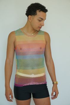 Rainbow Fishnet Long Tank Top by TAINOWEARS, a trendy and versatile sleeveless camisole perfect for making a bold fashion statement. This see-through mesh cover-up features a vibrant rainbow fishnet design, ideal for layering over your favorite bralette or swimsuit. Whether you're heading to the beach, a festival, or a casual day out, this stylish top adds a playful and eye-catching element to any outfit. Crafted from lightweight, breathable fabric, this crystal mesh top ensures comfort while ke Sleeveless Mesh Tank Top Vest, Fishnet Mesh Top For Summer Parties, Summer Party Mesh Top With Fishnet Details, Summer Party Fishnet Mesh Top, Mesh Camisole Tank Top For Summer, Sheer Fitted Tank Top For Summer, Fitted Sheer Tank Top For Summer, Party Mesh Camisole Tank Top, Stretch Multicolor Mesh Top For Summer