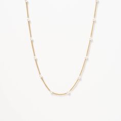 The Satellite Pearl Chain Necklace is a delicate and elegant piece of jewelry that is perfect for any occasion. Featuring a chain adorned with lustrous pearls, it has a minimalist design that exudes sophistication. Wear it alone or layer it with other necklaces to create a unique look that reflects your personal style. Formal Pearl Chain Necklace In Gold Plated, Formal Gold Plated Pearl Chain Necklace, Formal Gold-plated Pearl Chain Necklace, Classic White Chain Necklace With Pearl Charm, Elegant Pearl White Chain Necklace With Delicate Chain, Classic Pearl Clavicle Chain Necklace, Dainty Everyday Pearl Chain Necklace, Formal Pearl White Chain Necklace With Pearl Chain, Elegant Satellite Chain Necklace For Layering