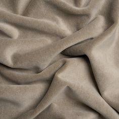 a close up view of a plain, light gray colored fabric that is very soft