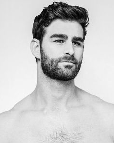 a man with a beard and no shirt