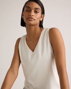 We're all about upgrading the essentials. This classic tank is made from washable silk, with a bit of stretch for the perfect fit. Effortless. A-line. No dry cleaning runs needed. Perfect for layering at the office or days lounging at home. Plus, silk fiber contains 18 kinds of amino acids that make it amazing for skin nourishment, hypo-allergenic, and naturally thermoregulating to help maintain body temperature. Also offered in sizes 1X - 3X.  | Quince | Women's 100% Washable Silk Stretch Tank Elegant Spring Tank Top With Minimal Stretch, Classic Sleeveless Tank Top For Summer, Classic Tank Top For Layering, Classic Solid Color Tank Top For Spring, Classic V-neck Tank Top For Summer, Classic Sleeveless Blouse Tank Top For Spring, Classic Sleeveless Camisole For Spring, Classic Sleeveless Tank Top For Spring, Classic Sleeveless Spring Camisole