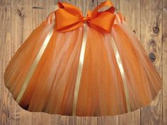 Quality hand-made tutus that last! At Katsteesandtutus, we create custom, hand-made tutus, accessories, bows, and more, especially for you! I have over 15 years of experience making these particular items and only use the best materials available. This tutu made with orange and white tulle with ribbons and a bow is sure to be a favorite for those adorable newborn photo shoots, birthday party smash-cake photos, dress-up, or just going to the grocery store!  All of my tutus are hand-made by me. Th Cute Birthday Tutu Dress With Bow, White Tutu Dress With Bow For Birthday, Cute Tulle Tutu Dress With Bow, Orange Summer Party Tutu Dress, Newborn Photo Shoots, Infant Tutu, Newborn Tutu, Tutu Birthday, Cake Photos