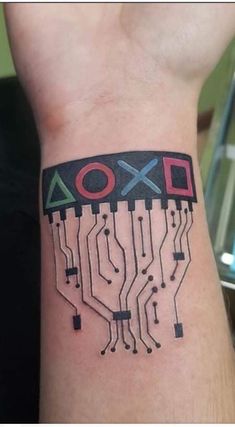 a wrist tattoo with an electronic circuit on it