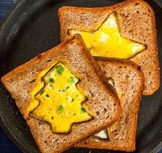 two pieces of toast with an image of a christmas tree on them are sitting in a frying pan