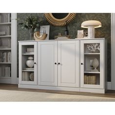 a white bookcase with two doors and shelves in front of a wall mounted mirror