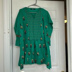 Brand New Khaadi Designer Pakistani Kurta Tunic Size S/M (Slightly Oversized) Full Embroidery Detailing Work On Shirt And Sleeves Green V-neck Kurta With Resham Embroidery, Traditional Green V-neck Tunic, Casual Cotton Blouse For Eid, Spring Green Kurta With Printed Motifs, Green Kurta With Printed Motifs For Spring, Green Printed Kurta For Spring, Green V-neck Kurta For Eid, Casual Green Straight Kurta Top, Spring Bollywood Style V-neck Kurta