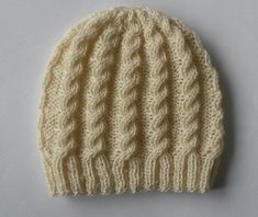 a white knitted hat on a table