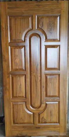 a wooden door that has been made to look like it is in the shape of a letter