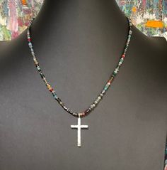 "BOHO UNISEX beaded choker in different sizes. Adjustable lengths. Nina Dunn ancient  silver hammered large cross pendant. Also comes in gold and Sterling Silver. Stainless large clasp with extension. Different sizes available. The necklace listed is 18.5\". Other sizes made to order. Free gift of the month and free shipping for purchases over $35. Exclusive Studio design (each beaded necklace is original, even with the same bead mix, they are all unique artistic works.) All jewelry is handmade, Silver Cross Beaded Necklace For Spiritual Style, Silver Spiritual Cross Beaded Necklace, Spiritual Silver Cross Beaded Necklace, Beaded Spiritual Cross Pendant Necklace, Spiritual Cross Necklace With Polished Beads, Silver Bohemian Cross Necklace, Personalized Pendant, Studio Design, Hammered Silver