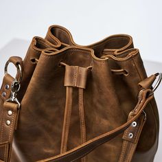 Leather Bucket Satchel For On-the-go, Leather Crossbody Bucket Bag For On-the-go, Leather Hobo Bag With Bucket Shape, Leather Bucket Shoulder Bag For Daily Use, Leather Bucket Satchel With Leather Handles, Versatile Large Capacity Bucket Bag, Soft Leather Bucket Bag For Everyday Use, Everyday Soft Leather Bucket Bag, Bucket Bag For Daily Use