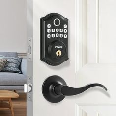 an open door with a keypad on it and a living room in the background