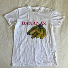 Bananas Graphic Tee, Fruit Shirt, Fruit Shirt, Fruit Shirt, Gift for Her, Vintage Unisex T-Shirt * 100% ring-spun cotton * Fabric weight: 6.1 oz/yd² (206.8 g/m²) * Garment-dyed * Relaxed fit * 7/8″ double-needle topstitched collar * Twill-taped neck and shoulders for extra durability * Double-needle armhole, sleeve, and bottom hems Fruit Shirt, Cool Girl Outfits, Baby Crop Top, Dream Clothes, Shirt Price, Bananas, New Day, Unisex T Shirt, Graphic Tee