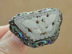 Stunning and rare find antique Chinese export sterling silver filigree ring with carved white Hetain butterfly jade sets in center.  The ring in great vintage condition with minor wear of the gold plating and with no missing enamel or damages.  Ring is marked Silver inside the band but only VER is stamped clearly and visible. Measurement,  Front is about 1.4 inch (36mm) by 0.95 inch (24mm) and it weights 10.9 grams.  Ring is with adjustable band and it's size to U.S ring size 5 right now. Jade Butterfly, Rough Stone Ring, Steampunk Heart, Large Stone Rings, Silver Rose Ring, Antique Jade, Asian Jewelry, Handmade Sterling Silver Rings, Compass Necklace