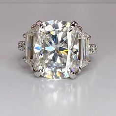 "This is a Elongated cushion cut moissanite engagement ring set in 14K solid gold. The Three stone wedding ring is Unique Cushion cut bridal anniversary rings. The ring pictured is Zonar Moissanite #7879 Zonar Moissanite by Infinity is our own hand cut moissanite near colorless stone.   All of our moissanite stones come with a limited lifetime warranty and an authenticity card is included. Moissanite may take up to 5 to 10 business days to complete and ship, sometimes sooner. -Approximate total 3stone Engagement Ring With Band, Three Stone Wedding Ring, Cushion Cut Moissanite Engagement Ring, Moissanite Engagement Ring Cushion Cut, Stone Wedding Ring, Elongated Cushion Cut, Elongated Cushion, Cushion Cut Moissanite, Stone Wedding