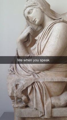 a statue with the words me when you speak