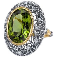 This is a truly beautiful ring, from the size and quality of peridot it features to the exquisite Florentine inspired craftsmanship. The large oval peridot is clear and crystalline, with bright, "Granny Smith" apple green color, set in 18k yellow gold to highlight its beauty. If August is your birth month, peridot is your birthstone. Sparkling round brilliant cut diamonds further adorn the white gold portion of the ring which has been intricately pierced, creating an elegant, regal appearance. Handmade in Italy. Peridot, 16.30 x 11.50 x 7.10mm, 8.85 carats Round brilliant cut diamonds, .24 carat total Ring size 7 Complimentary sizing as needed Granny Smith Apple, Beautiful Tiaras, Dome Ring, Sapphire Diamond Ring, Granny Smith, Domed Ring, Pretty Rings, Apple Green, Birth Month