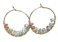 Hammered hoops with apatite, peridot, citrine, and ruby wrapped around inside, about 1-1/2" long Available in 14k gold filled & sterling silver, 14k rose gold filled**We now offer LAYAWAY**Please read our policy section for more info - http://www.etsy.com/shop/CalicoJunoJewelry/policy Unique Gemstone Hoop Jewelry, Multi-stone Hoop Jewelry For Gifts, Apatite Round Beads For Jewelry Making, Handmade Tourmaline Gemstones, Ear Art, K Rose, Branch Earrings, Vermeil Jewelry, Silver Prices