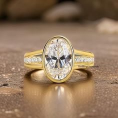 a close up of a ring with a diamond in it on a wooden table top