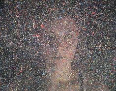 a person standing in front of a large amount of confetti