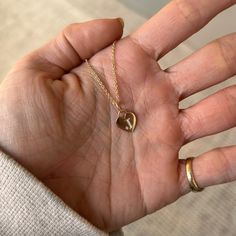 This Classic Heart Charm can be worn in so many different ways: on its own, short or long, clustered with other collected pieces, or on a bracelet. It's such a simple and beautiful piece, you really can't go wrong! It was designed with intention. The nice, thick piece of gold allows for a weighty feel. Its jump ring and bail are fixed together, making it sturdy and more visually appealing. Lastly, it's intentionally a blank slate - beautiful on its own and with so many options to customize it - engraving special names or dates, adding diamonds, sapphires, or rubies.. the list goes on! Heirloom Heart Shaped Charm Necklace, 14k Gold Heart Pendant Charm Necklace, Heart Charm Pendant Jewelry For Wedding, Minimalist Jewelry With Heart Charm Round Pendant, Minimalist Jewelry With Heart Charm On Round Pendant, Heart-shaped Rose Gold Charm Jewelry, Sterling Silver Heart Pendant Charm Necklace, Tarnish Resistant, 14k Gold Heart Charm Necklace, Sterling Silver Tarnish Resistant Heart Pendant Charm Necklace