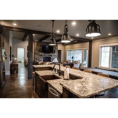 a large kitchen with an island and pool table