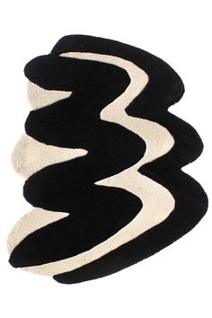 three black and white rugs on top of each other in the shape of waves