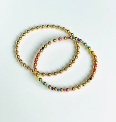 "\"One is silver and the other gold,\" - That is what came to my mind when making these bracelets! These luxe friendship bracelets are made with alternating 14K gold filled and sterling silver 4mm and 2mm beads. The best of both worlds! Looks great with any silver or gold stack! * New Rainbow friendship bracelets available now too! I love jewelry that is personal and tells a story. Let me know how I can personalize pieces for you! - need a special size you don't see? Message me and I will be hap Gold Minimalist Friendship Bracelets With Round Beads, Adjustable Gold Friendship Bracelets With Spacer Beads, Gold Friendship Bracelets With Colorful Beads As Gift, Gold Beaded Bracelet With Tiny 14k Gold Filled Beads, Friendship Bracelets With Colorful Beads As Gift, Gold Friendship Bracelets With Colorful Beads, Gold 14k Gold-filled Tiny Beaded Bracelets, Gold Jewelry With Colorful Beads For Everyday, Everyday Gold Jewelry With Colorful Beads