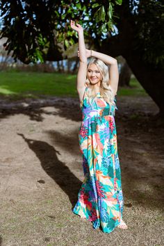 Our Gorgeous Tiered Maxi Dress is the perfect item to pack for your next tropical vacation! Featuring ric-rac detailing, adjustable straps, and a fun, vibrant tropical print tiered skirt that is designed to flow as easy as the sea breeze. Pair this beach dress with a trendy floppy hat, your favorite shades and wedge sandals for the perfect resort outfit! Item Description: Maxi Dress Tiered Hemline Square Neckline Tropical Print Ric Rac Trim Details Adjustable Tie Straps Fabric Content: 100% Poly Beachy Multicolor Maxi Dress With Tropical Print, Beachy Multicolor Tropical Print Maxi Dress, Tropical Sundress For Vacation, Tropical Sundress With Tropical Print For Vacation, Tropical Print Sundress For Vacation, Tropical Sundress For Beach Party, Tropical Maxi Dress With Vibrant Print For Garden Party, Tropical Floral Print Sundress For Vacation, Tropical Vacation Dresses With Vibrant Print