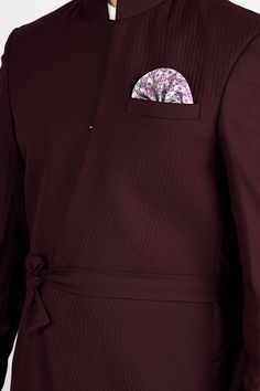 Exude timeless charm and sophistication with our Umber Maroon Wool Rich Bandhgala Designer Blazer, featuring concealed pockets and a belt closure for the perfect fusion of style and convenience! The rich Umber Maroon hue adds a touch of regal allure, making you the center of attention at any event. Crafted with premium wool-rich fabric, it ensures unmatched comfort and luxury. The concealed pockets add a modern and sleek touch, while the belt closure accentuates your silhouette, creating a disti Brown Suede Chelsea Boots, Blazer For Men, Suede Chelsea Boots, Travel Pants, Blazer Designs, Rich Fabric, Long Blazer, Blazer And Shorts, Luxury Linen