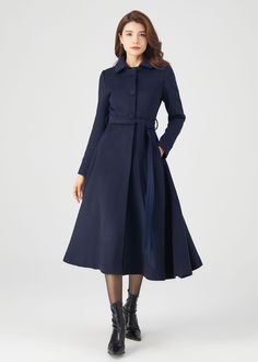 "FEATURES 50% wool, 50% wool blend Fully liner with polyester Two pockets Lapel collar Long sleeve Button closure in front Belt waist Navy wool coat Long wool coat For Winter, Autumn dry clean ★★Mode size Height 170cm (5′ 7″)  Bust 84 cm (33\")  Waist 66 cm (26\")  She wears size XS. ★★Bespoke Order Service If you Request other color Request the length Your height is not between 155 cm- 175 cm Your weight is not between 47 kg -77 kg I can do it for you, It will need some extra fee depending on o Tailored A-line Outerwear For Winter, Single Breasted A-line Outerwear For Work, Chic A-line Wool Coat For Work, Tailored Belted Wool Coat For Winter, Fitted Wool Coat With Belt, Belted Wool Coat Fitted, Elegant Long Sleeve Peacoat For Office, Elegant Office Peacoat With Long Sleeves, Elegant Office Peacoat