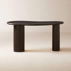 a black table sitting on top of a white floor