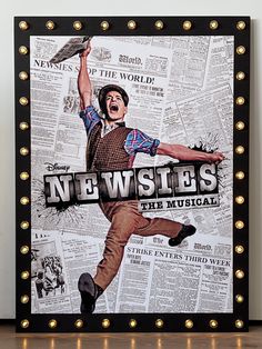 a framed poster with the words newsies on it